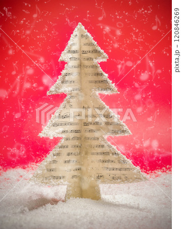 Musical Christmas Tree Made of Sheet Music in Snowy Setting Musical Christmas Tree Made of Sheet Music in Snowy Setting 120846269