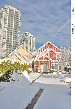 Modern high-rise and private residential houses in snow on winter season 120846686