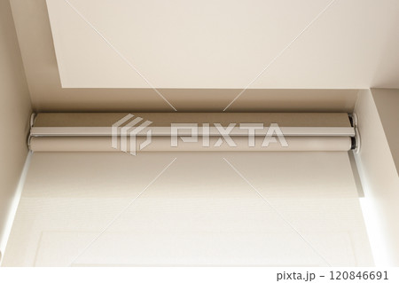 The image showcases a modern double roller blind system with automatic control, featuring two layers for optimal light adjustment and privacy. Minimalistic design complements contemporary interiors. The image showcases a modern double roller blind system with automatic control, featuring two layers for optimal light adjustment and privacy. Minimalistic design complements contemporary interiors. 120846691