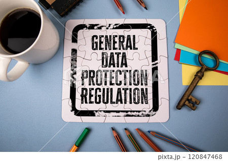 General Data Protection Regulation. White puzzle and office supplies on table 120847468