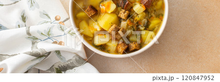 Pea soup with fried croutons Pea soup with fried croutons 120847952