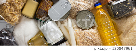 Canned goods, cereals, and pasta stored for quarantine and isolation, ensuring long-term survival and food security at home, survival during military operations, the concept of stay at home, banner Canned goods, cereals, and pasta stored for quarantine and isolation, ensuring long-term survival and food security at home, survival during military operations, the concept of stay at home, banner 120847961