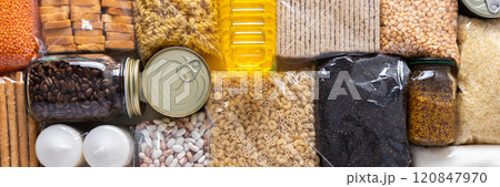 Home food supplies for quarantine and isolation, including canned food, cereals, pasta, and essential staples for survival, survival during military operations, the concept of stay at home, banner Home food supplies for quarantine and isolation, including canned food, cereals, pasta, and essential staples for survival, survival during military operations, the concept of stay at home, banner 120847970