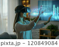 Woman Interacting with Augmented Reality Hologram 120849084