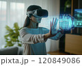Woman Using VR Headset with Holographic Display 120849086