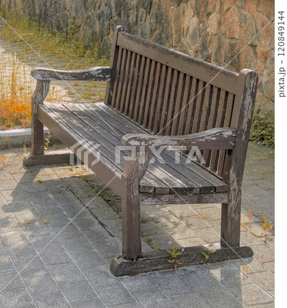 rustic bench on the street 120849144