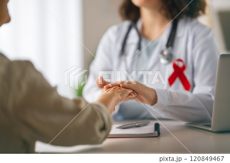 patient and a doctor in medical office 120849467