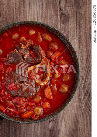 ossobuco stew with vegetables, knuckle on the bone with new potatoes, in tomato sauce,homemade, top view, no people, 120850679