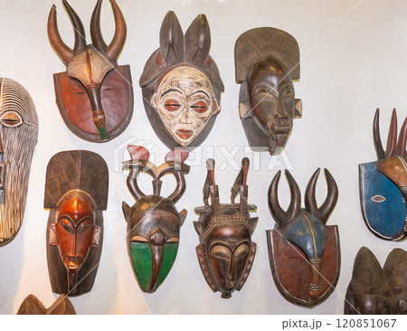 Vintage African wooden mask with traditional pattern isolated on white 120851067