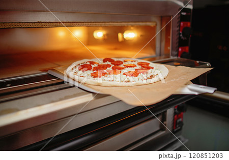 pizza in oven at night 120851203