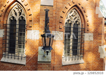 Vintage lantern and traditional old houses in Krakow, Poland. Vintage gasoline oil lantern lamp with a soft glow light 120852010