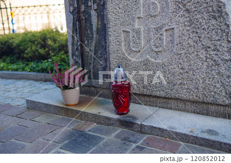 tombstones decorated with colorful seasonal chrysanthemum flowers in cemetery during religious christian traditional autumnal event 120852012