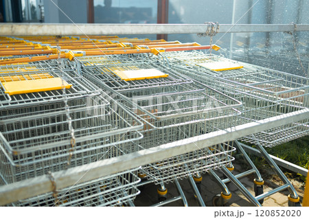 Shopping carts all lined up ready to be used to get groceries at store 120852020