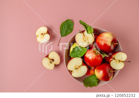 Bowl with tasty fresh red apples on pink background. Harvesting apples.Top view, flat lay, copy space. Bowl with tasty fresh red apples on pink background. Harvesting apples.Top view, flat lay, copy space. 120852232