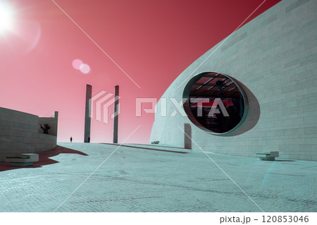 Futuristic landscape, Modern building architecture in the Champalimaud Foundation, oval windows in the wall leading to a garden with palm trees Futuristic landscape, Modern building architecture in the Champalimaud Foundation, oval windows in the wall leading to a garden with palm trees 120853046