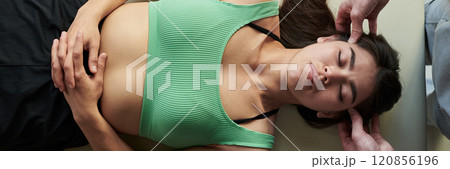 Receiving Therapeutic Massage with Hands Placement Receiving Therapeutic Massage with Hands Placement 120856196
