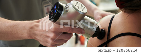 Using Massage Device on Shoulder for Therapy Using Massage Device on Shoulder for Therapy 120856214