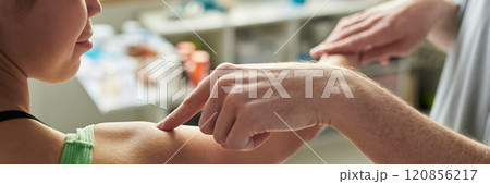 Close-Up of Person Receiving Arm Treatment in Medical Setting Close-Up of Person Receiving Arm Treatment in Medical Setting 120856217