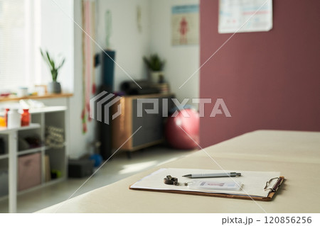Focusing on Clipboard in Peaceful Spa Room 120856256