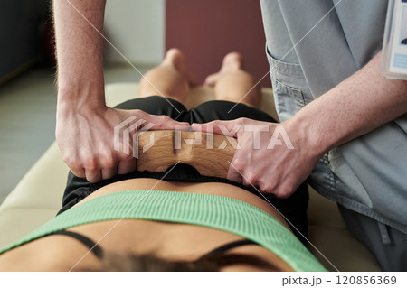 Performing Chiropractic Adjustment on Patient Performing Chiropractic Adjustment on Patient 120856369