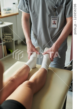 Medical Professional Providing Therapeutic Massage Medical Professional Providing Therapeutic Massage 120856396
