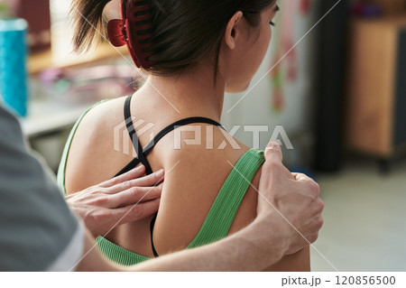 Giving Therapeutic Massage in Modern Studio Setting 120856500