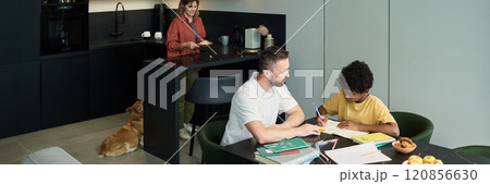 Father and Son Spending Time in Modern Kitchen Father and Son Spending Time in Modern Kitchen 120856630