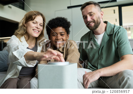 Family Having Fun with Interactive Technology Device 120856957