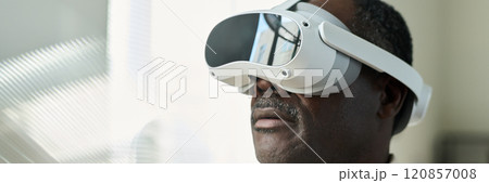 Watching presentation in VR headset 120857008