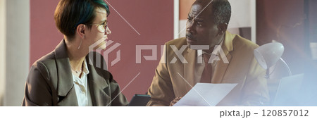 Discussing documents at working meeting 120857012