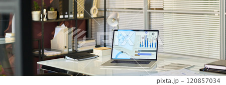 Workplace with laptop and documents Workplace with laptop and documents 120857034