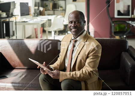 Businessman with financial documents 120857051