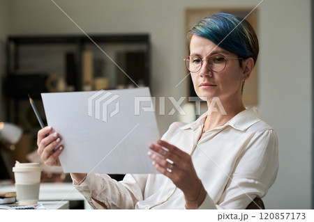 Young market analyst with document Young market analyst with document 120857173
