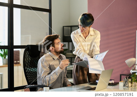 Economists discussing financial papers Economists discussing financial papers 120857191