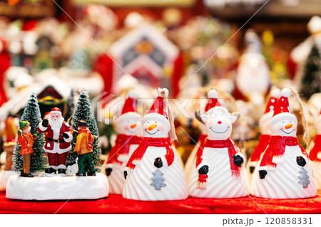 Snowman and Santa Claus Figurines in Festive Display 120858331