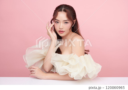 Beautiful young asian woman with clean fresh skin on pink background, Face care, Facial treatment, Cosmetology, beauty and spa, Asian women portrait. 120860965