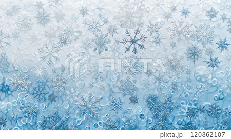 雪の結晶と光の粒の背景画像、水色のグラデーション 120862107