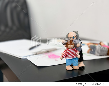 Colorful artistic dolls with sketches on desk background 120862830