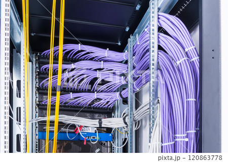 network cables connected into server inside data center 120863778