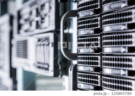 Cluster of data storage hard drives inside server room 120863780