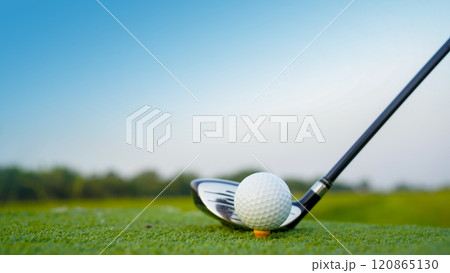 Golf clubs and golf balls on a green lawn in a beautiful golf course with morning sunshine. Golf clubs and golf balls on a green lawn in a beautiful golf course with morning sunshine. 120865130