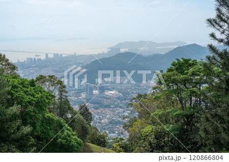 Panoramic view of GeorgeTown in Malaysia from hill, showing city skyline, high-rise buildings, lush green trees, sea with bridge, capturing vibrant urban life and natural beauty Panoramic view of GeorgeTown in Malaysia from hill, showing city skyline, high-rise buildings, lush green trees, sea with bridge, capturing vibrant urban life and natural beauty 120866804