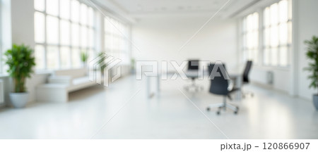 Bright modern office with blurred white background, comfortable chair, clean workspace, minimalistic design, contemporary furniture, light atmosphere, professional environment 120866907