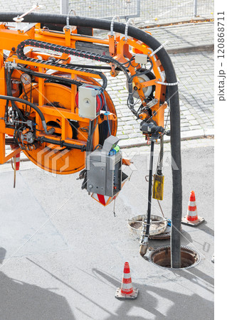Pipe hose sewage truck car engine emptying city street sewerage manhole. Septic cleaning vacuum service maintenance technology equipment industry. Suction vehicle cleaner machine pumping drainage Pipe hose sewage truck car engine emptying city street sewerage manhole. Septic cleaning vacuum service maintenance technology equipment industry. Suction vehicle cleaner machine pumping drainage 120868711