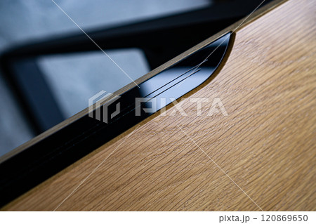 Empty rough wooden table top in the dark room Empty rough wooden table top in the dark room 120869650