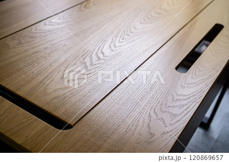 Empty rough wooden table top in the dark room 120869657