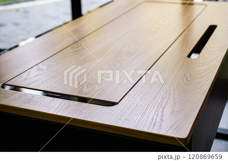 Empty rough wooden table top in the dark room 120869659