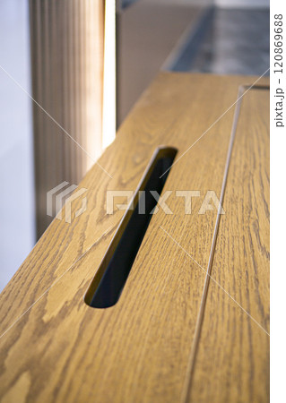 Empty rough wooden table top in the dark room 120869688