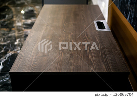 Empty rough wooden table top in the dark room 120869704