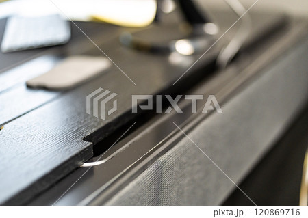 Mobile phone with wireless charger on table. Modern workplace accessory 120869716